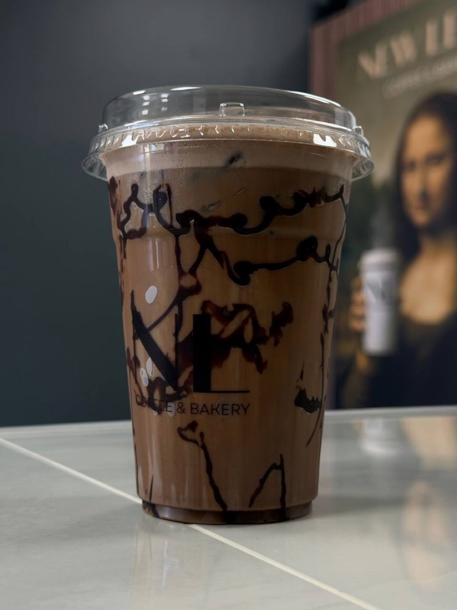 Mocha in a tall glass with whipped cream at New Level Coffee & Bakery